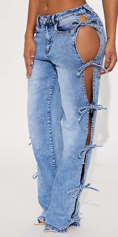 Dámske džínsové nohavice s odhalenými bokmi a mašličkami Modrá