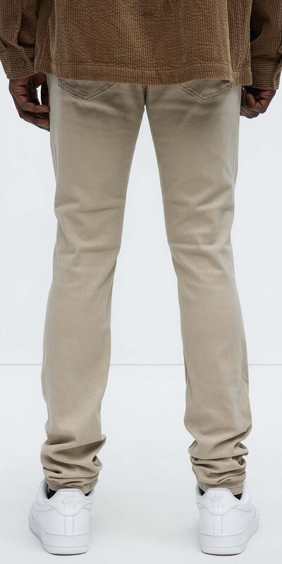 Béžové pánske skinny rifle s výrazným trhaným efektom Béžová