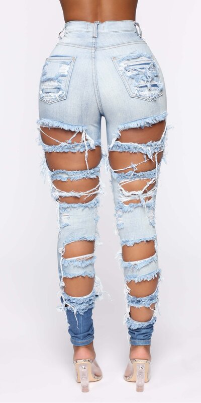 Modré skinny rifle s vysokým pásom a výrazne roztrhaným dizajnom