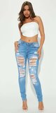 Bledomodré skinny džínsy s trhancami Tall