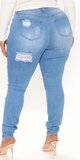 Bledomodré skinny džínsy s trhancami Tall