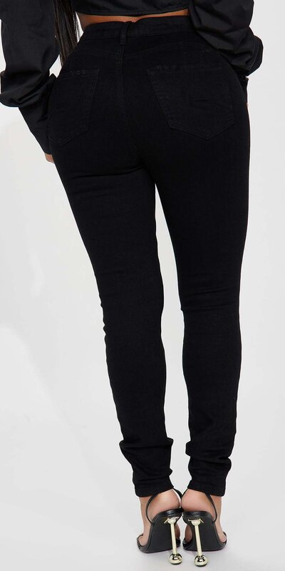 Čierne roztrhané skinny rifle s vysokým pásom