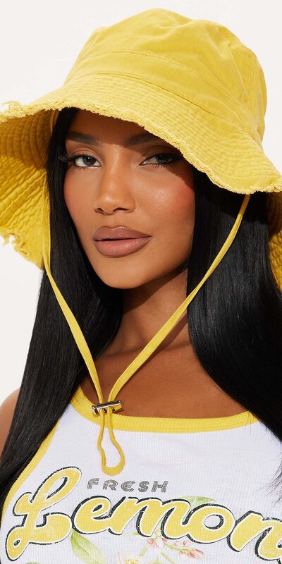 Žltý bucket klobúk s ošúchaným efektom a šnúrkou