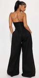 Čierny overal bez ramienok s asymetrickým výstrihom