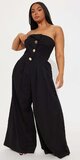 Čierny overal bez ramienok s asymetrickým výstrihom
