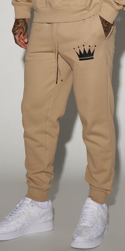 Béžové jogger tepláky s nápisom King