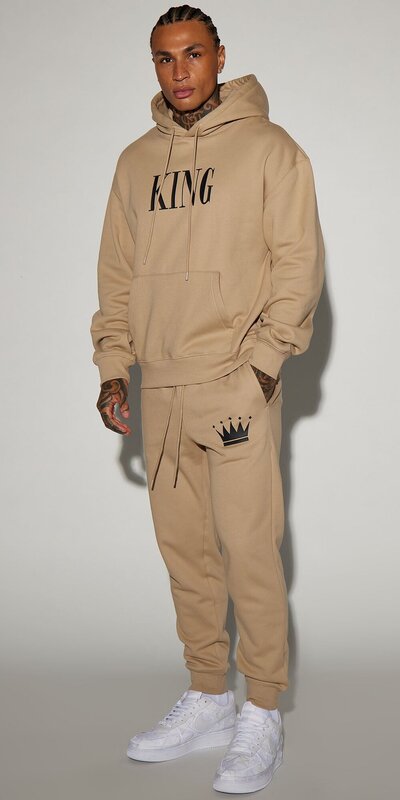 Béžové jogger tepláky s nápisom King
