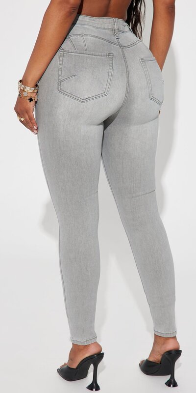 Sivé skinny rifle s vysokým pásom a tvarujúcim efektom