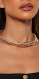 Zlatý choker náhrdelník s prepleteným trblietavým dizajnom