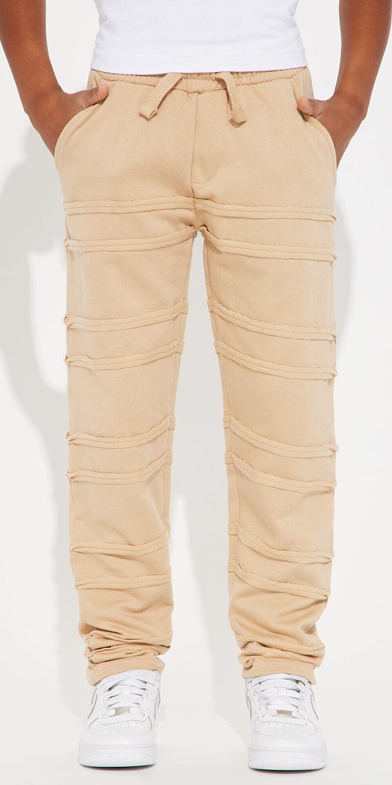 Teplákové nohavice s rovným strihom a strapkaným detailom v béžovej farbe