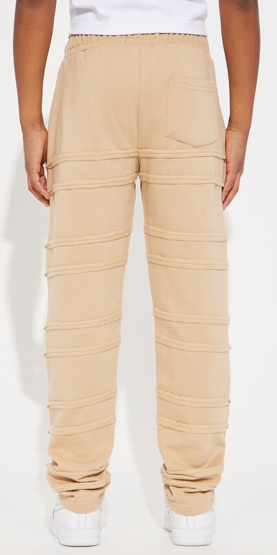 Teplákové nohavice s rovným strihom a strapkaným detailom v béžovej farbe