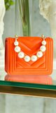 Mini dámska kabelka s perlami Oranžová